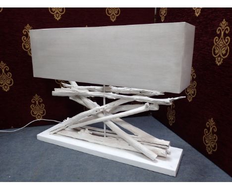 A DRIFTWOOD SCULPTURAL TABLE LAMP with rectangular shade