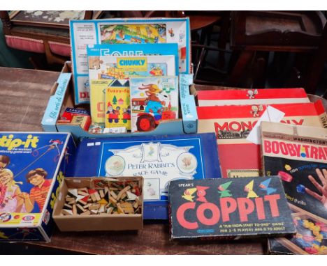 A COLLECTION OF VINTAGE GAMES to include 'Peter Rabbit's Race Game' Monopoly and Booby trap