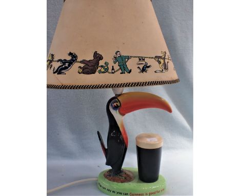 AN ORIGINAL CARLTON WARE  GUINNESS TOUCAN TABLE LAMP with the slogan, 'If he can say as you can Guinness is good for you' wit