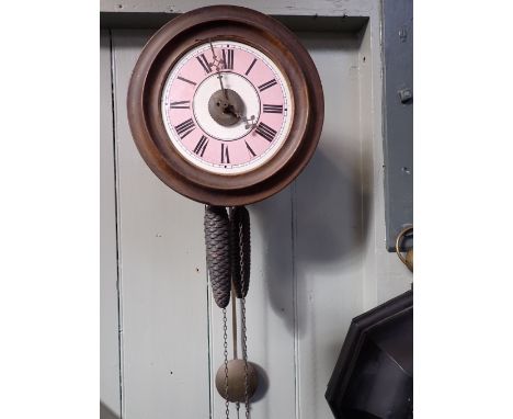 A POSTMAN'S ALARM CLOCK with pink and white enamel dial