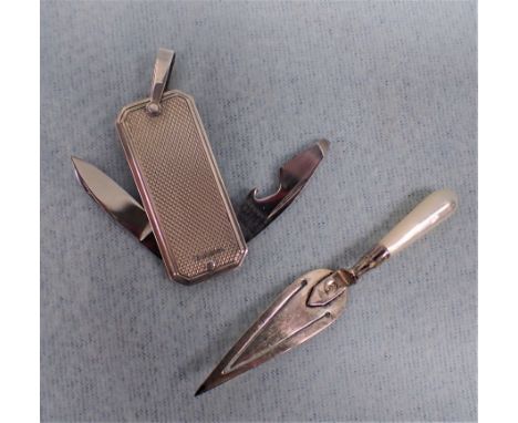 A SILVER 'TROWEL' BOOKMARK, WITH MOTHER-OF-PEARL HANDLE (925) and a hallmarked silver-sided pendant knife/bottle opener, with