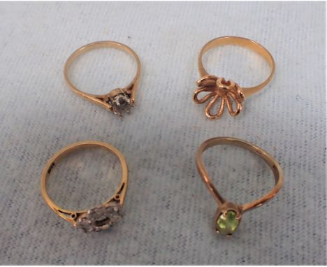 A 9 CT GOLD RING and other yellow metal rings