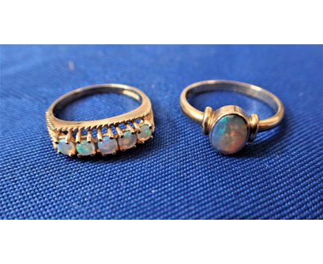 A FIVE STONE OPAL DRESS RING claw set with rope twist decoration, on a  9ct yellow gold shank, ring size O, together with a s