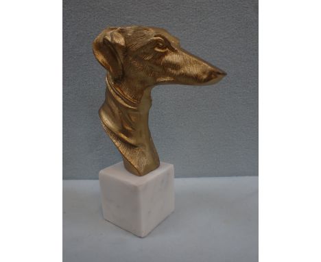 A CAST AND GILT GREYHOUND HEAD SCULPTURE on a marble plinth 26 cm high