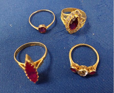 A SYNTHETIC RUBY MARQUISE CUT SINGLE STONE RING the stone approx 20 x 6mm, claw-set in a hallmarked 22ct yellow gold setting 