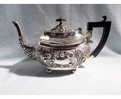 A SILVER TEAPOT WITH ROCOCO DECORATION 660g