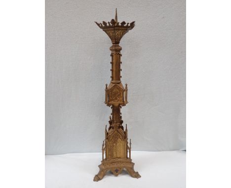 A VICTORIAN GILT BRASS GOTHIC REVIVAL PRICKET CANDLESTICK 76 CM HIGH