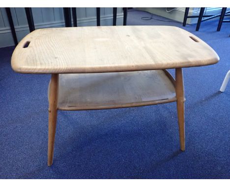 ERCOL: A BUTLER'S TRAY TYPE COFFEE TABLE in pale elm and beech, with pierced handles (two long side rails from undertier miss