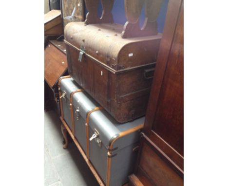 A VINTAGE TRAVEL TRUNK AND A TIN TRUNK
