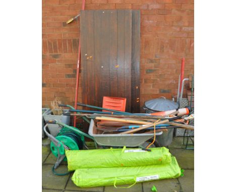 A COLLECTION OF GARDEN ITEMS, including a wheelbarrow, garden tools, two IKEA gazebos (unknown if complete), a galvanised dus
