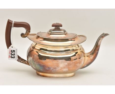 AN ELIZABETH II SILVER TEAPOT, of a polished form, gadrooned rim to the hinged cover, fitted with a light wooden finial and h