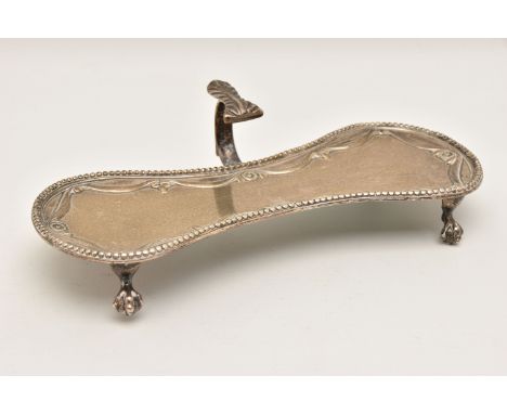 A GEORGE III SILVER CANDLE SNUFFER TRAY, curved tray with beaded rim and worn engraved crest to the centre, raised on four ta
