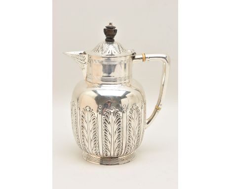 A LATE VICTORIAN SILVER COFFEE POT, foliate pattern, hinged cover fitted with an ebonised finial and handle, hallmarked 'Atki
