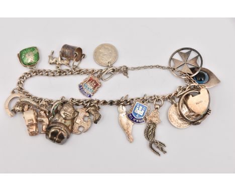 A WHITE METAL CHARM BRACELET, curb link bracelet with a heart padlock clasp stamped 'silver', with additional safety chain, f