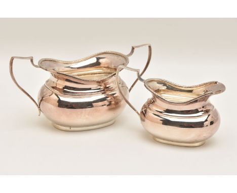 AN ELIZABETH II SILVER SUGAR BOWL AND MILK JUG, polished forms with gadrooned rims and handles, each hallmarked 'Charles S Gr