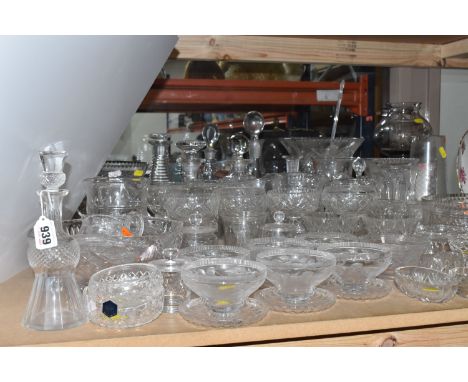 A COLLECTION OF CUT GLASS AND ETCHED GLASSWARE, to include decanters, grapefruit dishes, large punch bowls, vases, bud vases,