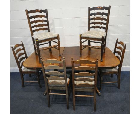 A 20TH CENTURY EXTENDING DINING TABLE, raised on shaped legs, united by a stretcher, extended length 182cm x closed length 14