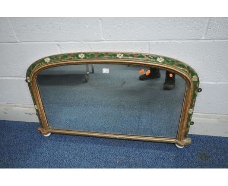 A 19TH CENTURY GILT WOOD AND GLOSSY PAINTED OVERMANTEL MIRROR, the frame with a foliate and moulded design, on ceramic drop f