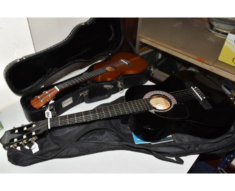 A UKELELE AND A 3/4 SIZE LEFT-HANDED GUITAR, both have cases, comprising a Laka ukelele with built in electronic tuner, no VU
