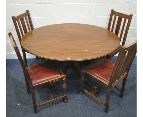 A 20TH CENTURY MAHOGANY OVAL TILT TOP TABLE, raised on a turned support and four legs, width 136cm x depth 107cm x height 74c