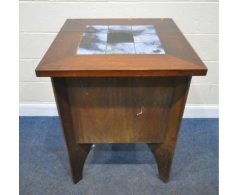 A MID CENTURY ROSEWOOD BAR, the square tile top surrounding a central ice bucket, two sides are plane, one side with eight wi