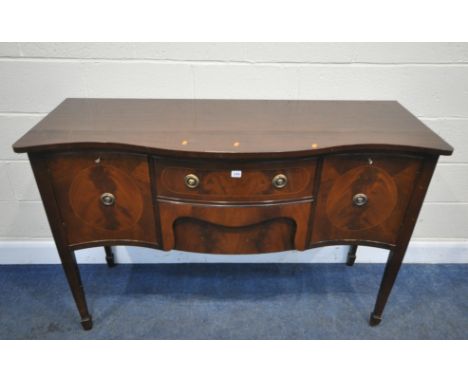 AN 20TH CENTURY MAHOGANY SERPENTINE SIDEBOARD, fitted with two drawers, flanked by double cupboard doors, raised on square ta