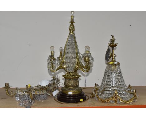 A GROUP OF THREE CRYSTAL CHANDELIERS, possibly French, comprising two Regency style gilt metal ring chandeliers hung with fac