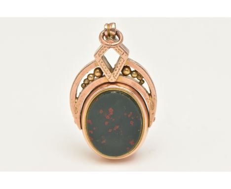 A ROSE METAL SWIVEL FOB, of an oval form, set with a bloodstone and sardonyx polished inlay, collet set within a rose metal m