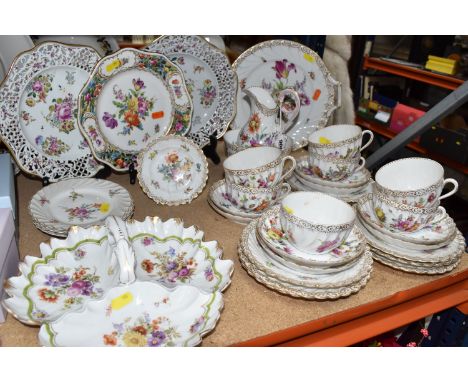 A GROUP OF HAND-PAINTED DRESDEN TEA WARE, hand painted with various floral designs and gilt pattern on a white background, co