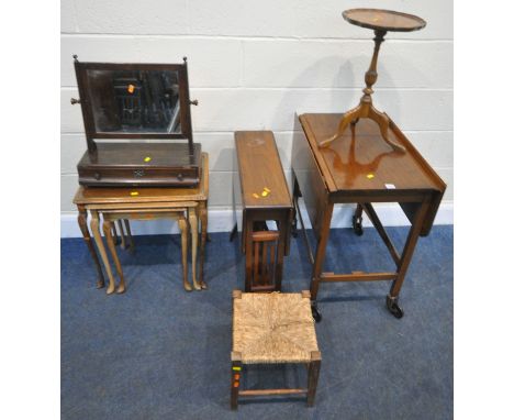 A SELECTION OF OCCASIONAL FURNITURE, to include a drop leaf trolley, a Sutherland table, a nest of three tables, a tripod tab