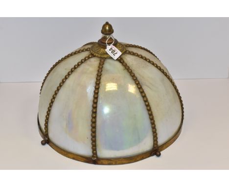 AN OPALESCENT TIFFANY STYLE HANGING LAMP SHADE with beaded gilt bands across the panels, with a metal acorn-shaped finial, fo