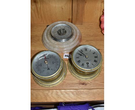 A SESTREL BULKHEAD STYLE CLOCK AND BAROMETER, WITH ANOTHER BAROMETER, comprising Sestrel wall clock and barometer, both marke