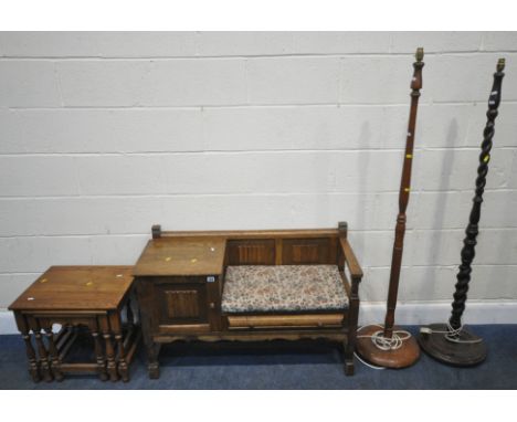 A 20TH CENTURY OAK TELEPHONE SEAT, with a single door, width 105cm x depth 42cm x height 68cm, a nest of three tables, along 