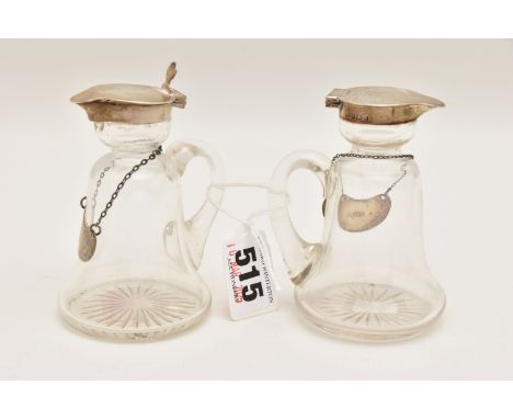TWO SILVER MOUNTED WHISKEY TOT GLASSES, AF, bell shaped glass bottles, fitted with hinged silver covers, (one silver cover is