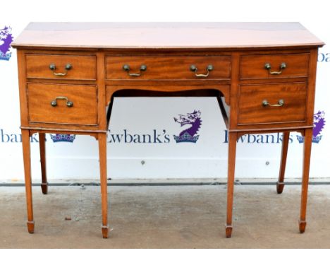 20th century mahogany bow fronted sideboard on spade feet. 124WQ x 62H x 60D           