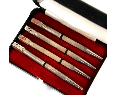 Cased set of four silver and enamel bridge pencils           