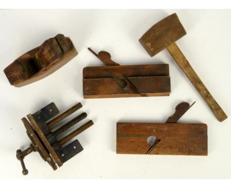 Collection of wooden tools in blue metal tool box           