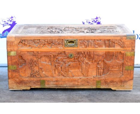 Oriental carved wood trunk, with figural decoration,           