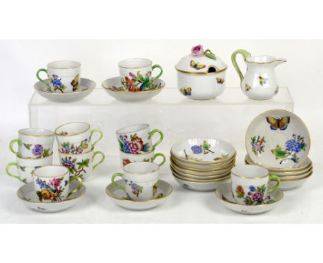 Herend 11 coffee cups and saucers, and spare saucers, decorated with butterflies and flowers, a cream jug decorated with bird