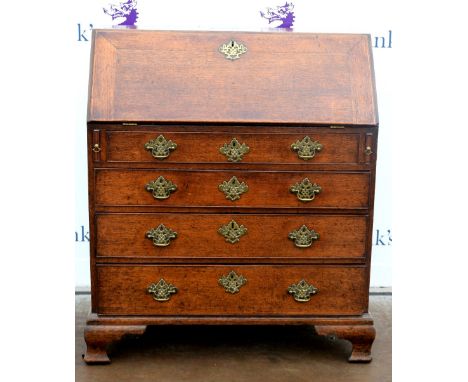19th century oak bureau, the fall front to reveal a fitted interior above four graduated drawers on ogee bracket feet. 92W x 
