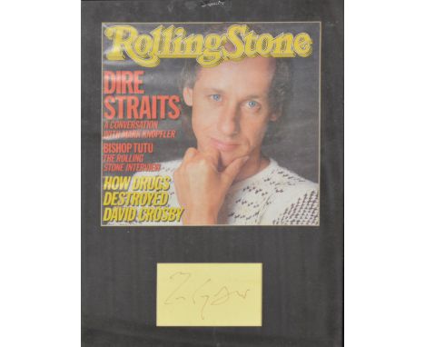 Dire Straits; signature of Mark Knopfler framed and glazed with a cover from Rolling Stones, 34cm by 24cm.