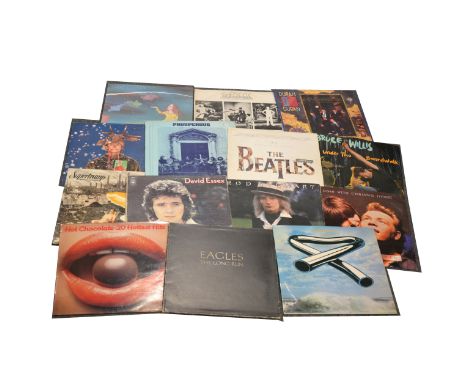 One box of mixed vinyl LP and 12" single records; aprox seventy-six, including The Rolling Stones, Elton John, Kenton, Banana