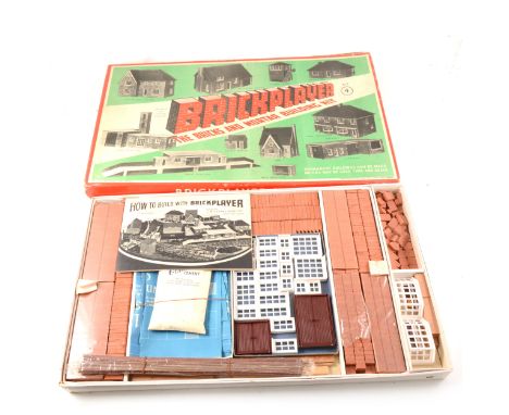 Brickplayer toy construction set, boxed, along with vintage toy block and pull-a-long cart.