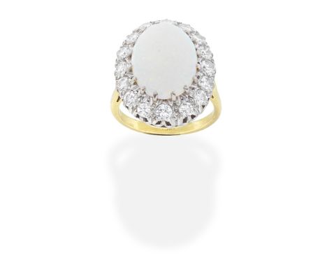 OPAL AND DIAMOND CLUSTER RINGThe oval cabochon opal, within a brilliant-cut diamond surround,  diamonds approx. 0.80ct total,