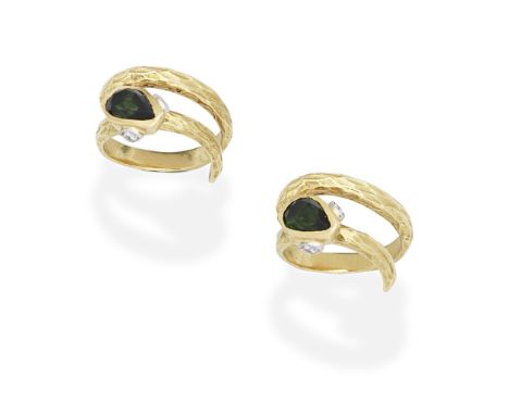 CARTIER: TOURMALINE AND DIAMOND DOUBLE SNAKE RINGDesigned as two textured and interlocking coiling snakes, each with a tourma