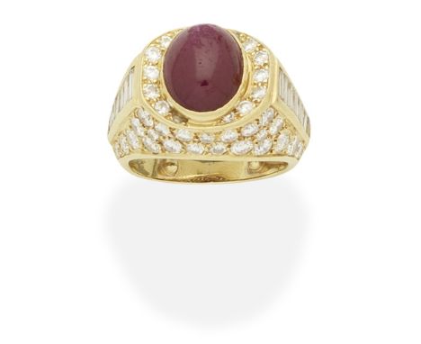 VAN CLEEF &amp; ARPELS: RUBY AND DIAMOND-SET DRESS RINGThe oval cabochon ruby within a mount set with brilliant and baguette-