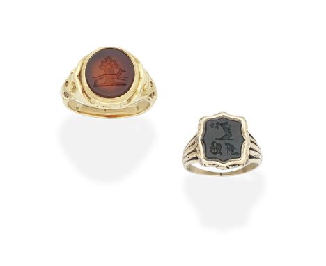TWO INTAGLIO SIGNET RINGS, 19TH CENTURY1st: The carnelian signet ring carved to depict the 'Watney' family armorial crest, 2n