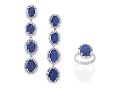 SAPPHIRE AND DIAMOND RING AND EARRING SUITEThe ring set with a star sapphire within a brilliant-cut diamond surround, mounted