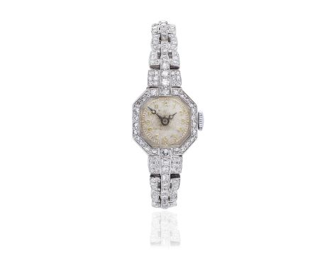 DIAMOND-SET WATCHThe circular dial with Arabic numerals within an octagonal surround, the bezel and bracelet set throughout w