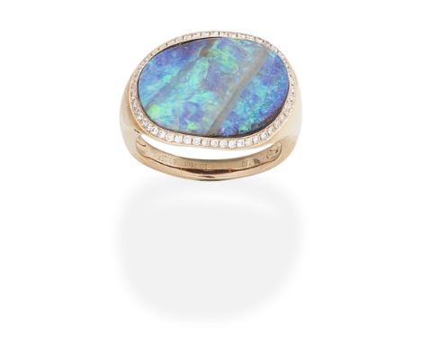 FEI LIU: BOULDER OPAL AND DIAMOND RINGThe asymmetrical boulder opal set within a surround of brilliant-cut diamonds,  ring si